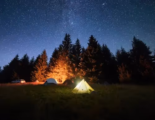 A glowing campfire under the stars