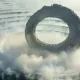 10025