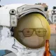 11077