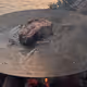 Steak on a plate, by the lake