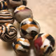 Balius Necklace Eighteen Gold White Brown and Black Striped Polymer Cubes