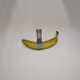 Banana taped to a wall - old