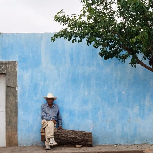 Old man and blue wall 