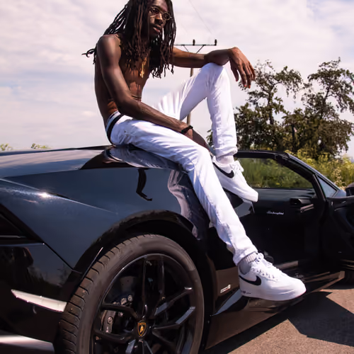 purple swag in the black lamborghini.