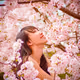 beautiful woman with sakura blossoms
