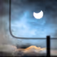 Solar eclipse over the roofs