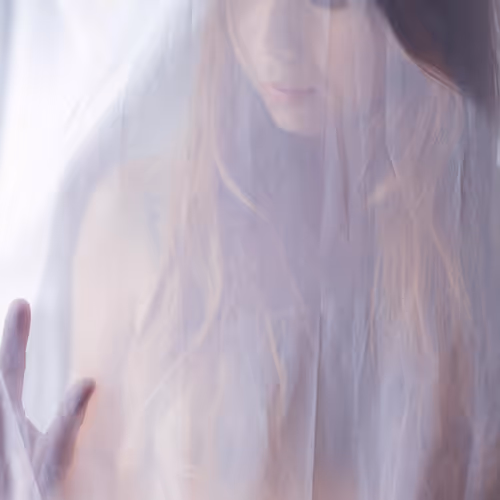 woman behind sheer fabric - old