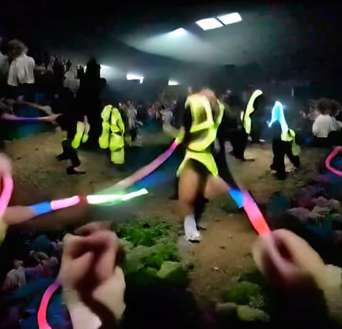 Dancing at a rave with glow sticks on acid