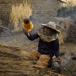 Ethiopia - Sisay Harvesting Honey in His Backyard