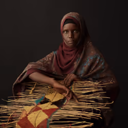 Ethiopia - Portraits - Portrait of Besharo with woven carpet