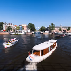 Day Timelapse • Busy Amstel Canal Intersection in Amsterdam
