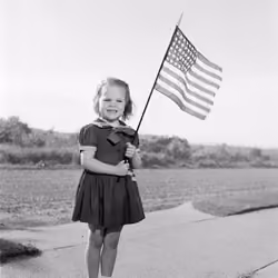 Patriotic Young Girl Holding US Flag