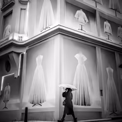 An Umbrella between dresses