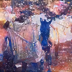 loaded horses under a snowfall in mountains