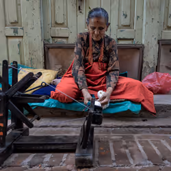 woman spinning wool