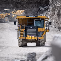 CAT 775G Rigid Frame Haul Truck In Rock Quarry