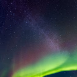 Aurora borealis meets Milky Way