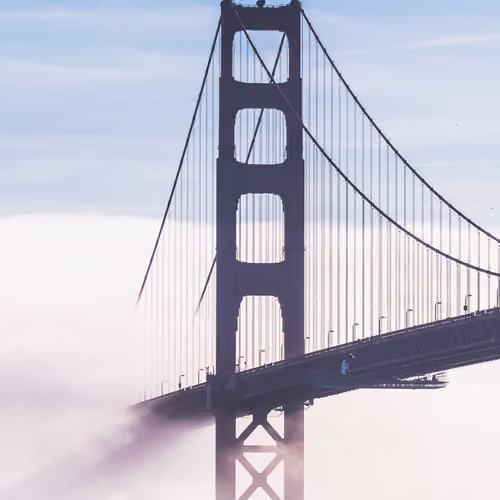 A tug boat passing under the Golden Gate