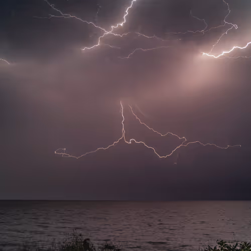 Lightning Skipping Across The Sky by Dave Paddick