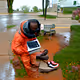 Black man in wisconsin wearing nice shoes typing words on coumputer on Mars in the rain gan 5 no sea