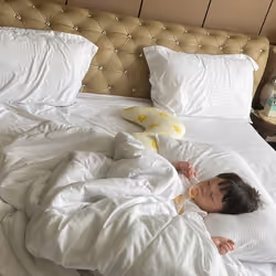 Clinton sleeping by his own