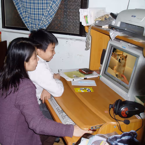 Boy and his mother looking at Doge #1