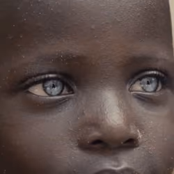 black boy with blue eyes