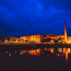 The Pumphouse and Albert Dock reflecting in the calm water on the Liverpool waterfront