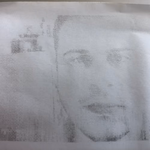 Self-portrait on receipt paper