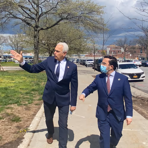 Avi walks with Council Member Robert Holden at the proposed jail site in Kew Gardens. May 2021