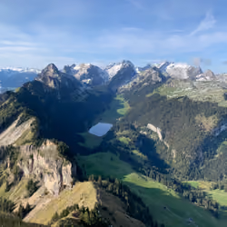 #0011 Lake between swiss mountains