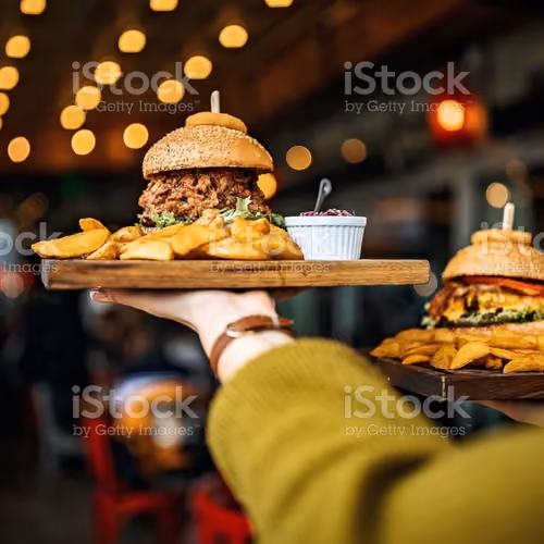 Woman carrying burger