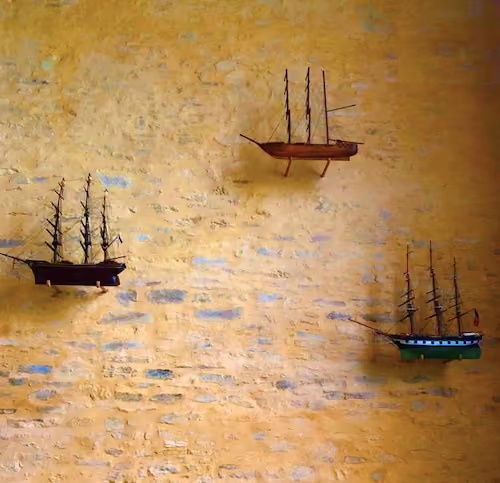 Three ships on an orange sea