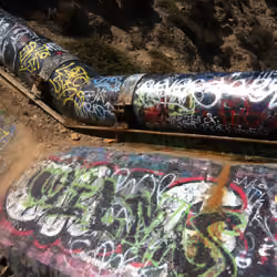 Graffiti Art on Pipeline in Los Angeles California Royalty Free Professional Photography
