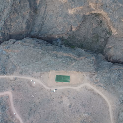 soccer play ground bewteen the mountains