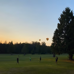 Children play at Sunset with Balloons