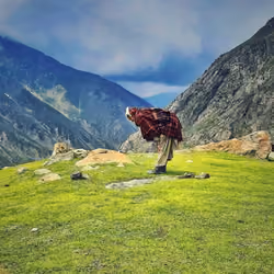 A man praying on the top of mountain almost 30000km above from the sea level 