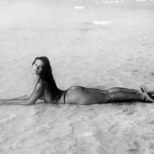  the girl lies on the salty earth