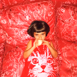 Pia on Red Couch