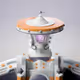 7025