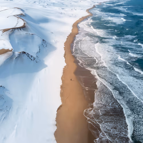Tranquil Snow Dunes, Raging Ocean Waves
