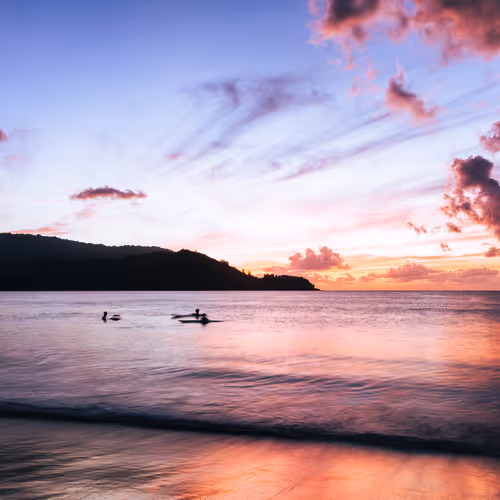3 Surfers in Hanalei Bay