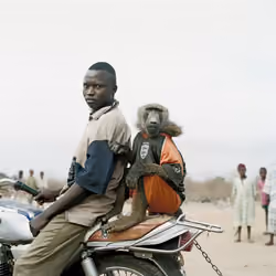 Motorbike rider with Amiloo, Abuja, Nigeria, 2005