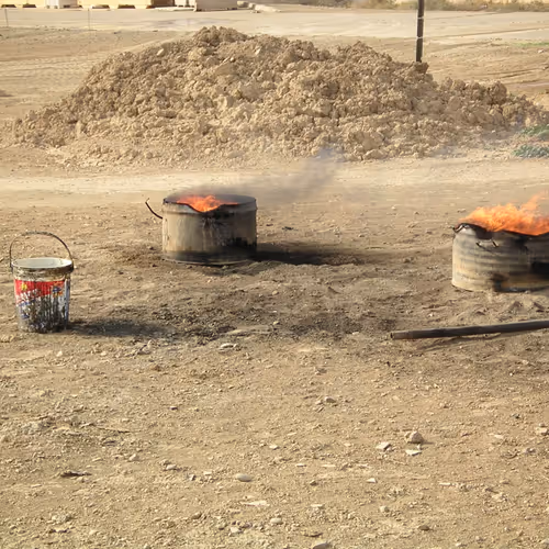 Burning barrels of poop