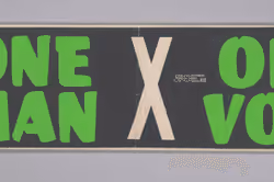 Bumper sticker with the slogan One Man, One Vote 2010.71.10