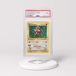 [THIS NFT HAS MOVED] 1999 Pokémon Base Set Shadowless 1st Edition Holo Hitmonchan #7 (PSA 28930337)