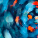 A blurry image of blue and orange leaves.
