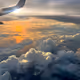 SUNSET OVER THE CLOUDS