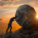 Man pushing boulder