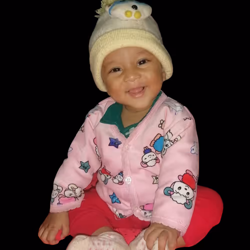 A Joyful Baby's Radiant Smile Indoors